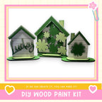 three small, green-colored houses with the word "Lucky" written on them, placed on a pink and yellow background.
