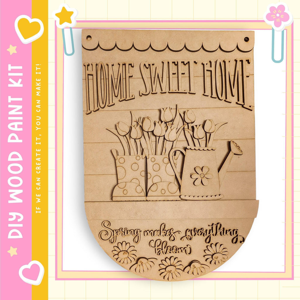 A wooden sign with the text "HOME SWEET HOME" and an illustration of a watering can and flowers.