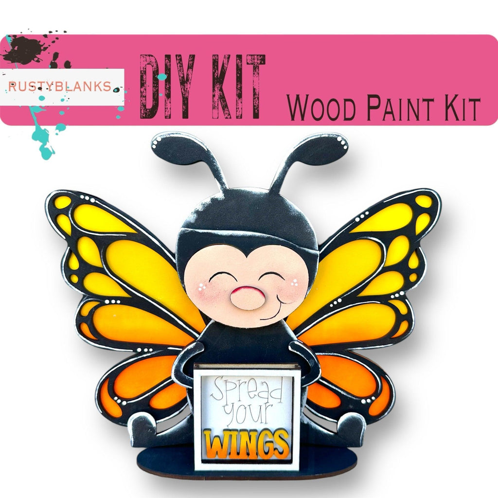 a picture of a butterfly with a sign that says, diy kit wood paint
