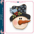 A wooden snowman with a hat, carrot nose, and a blue bird perched on top, set against a white background.
