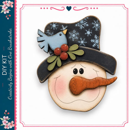 A wooden snowman with a hat, carrot nose, and a blue bird perched on top, set against a white background.