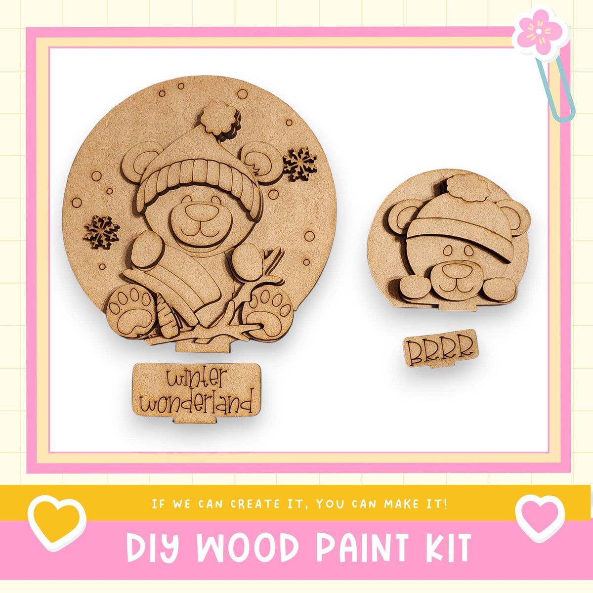 a DIY wood paint kit with two wooden bear-shaped cutouts, one larger and one smaller, both wearing winter hats and scarves. The kit includes a label that says "Winter wonderland" and a heart symbol, suggesting a festive or holiday theme. The text "If we can create it, you can make it!" is also present, indicating that the kit is designed for customization and creativity.