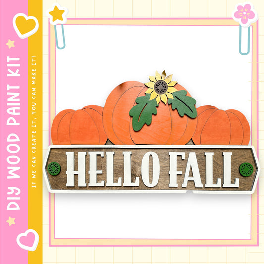 The image is a colorful and festive fall-themed collage featuring a wooden sign with the text "Hello Fall" and various autumn-themed elements such as pumpkins and a sunflower.