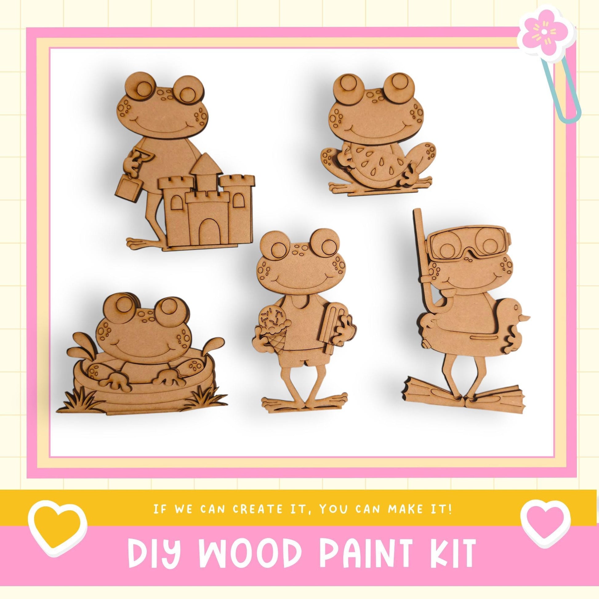 a DIY wood paint kit with five wooden frog figures in various poses, including one sitting on a castle, one holding a book, one holding a stick, one holding a stick and a book, and one holding a stick and a book.