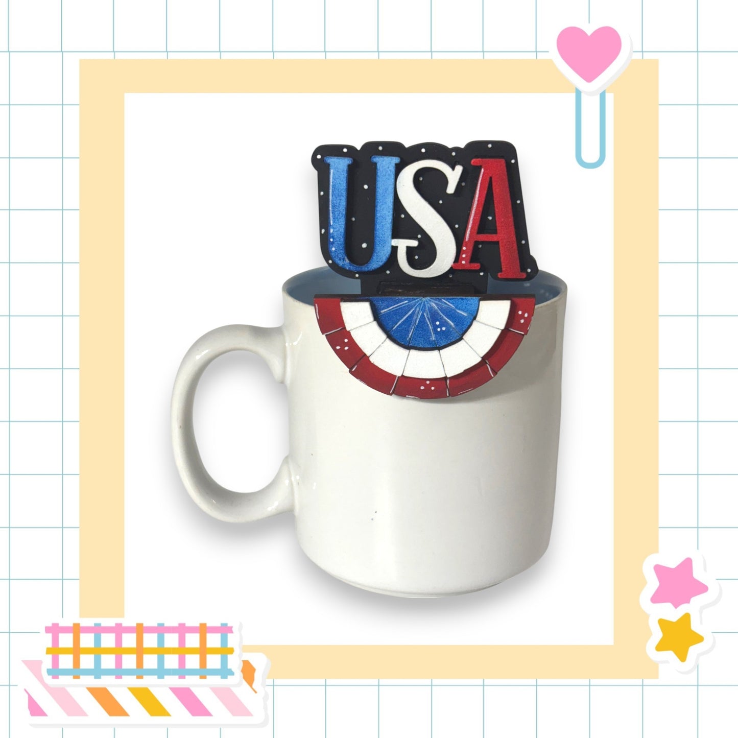 A white mug with the word "USA" written on it, placed on a yellow grid background.