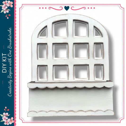 a white wooden window with a scalloped trim, set against a white background.