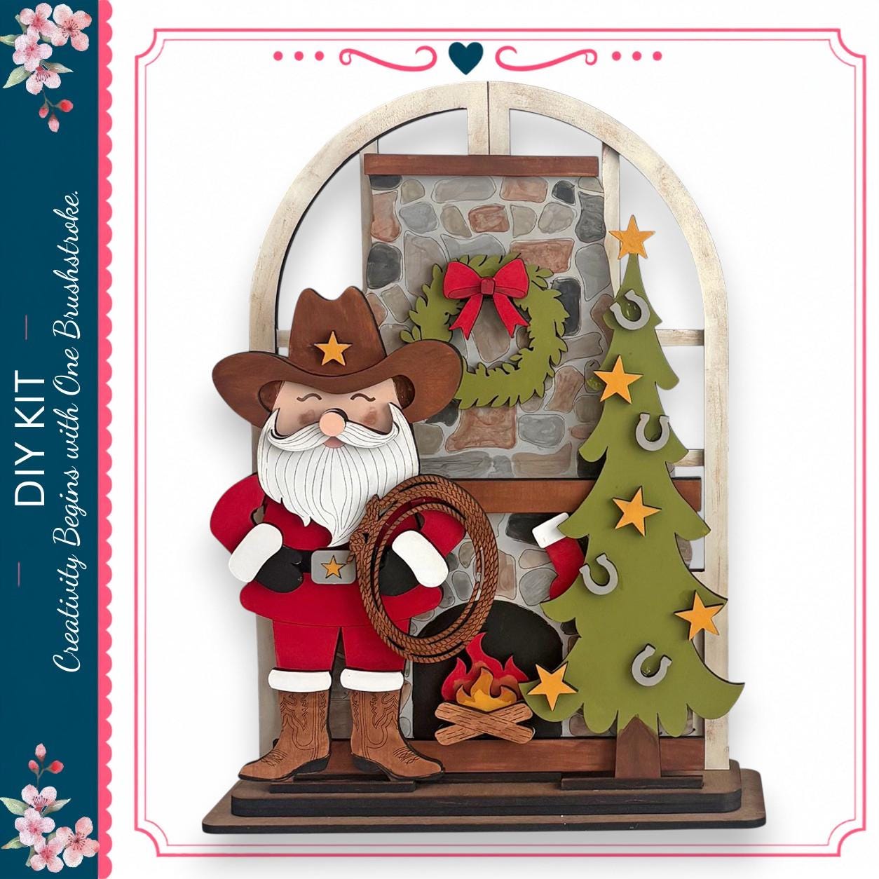 A wooden Santa Claus figure holding a lasso stands in front of a Christmas tree and wreath, with a brick fireplace and a wreath above the fireplace.