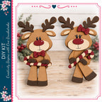 two wooden reindeer figures holding candy canes, set against a background of pine branches and red berries.