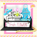 a sign that says fresh flowers and a potted plant