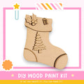 a DIY wood paint kit for creating a wooden stocking, with a picture of a wooden stocking and a tag that says "Santa's Gift".