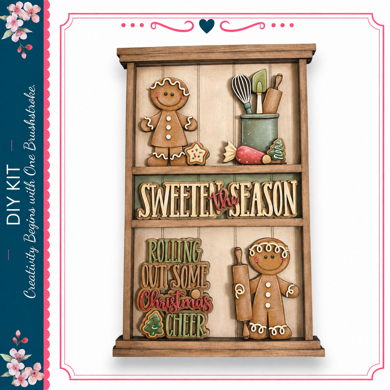 The image is a wooden display with various gingerbread-themed decorations, including gingerbread men, gingerbread cookies, and other festive elements. The display is titled "Sweeten the Season" and includes phrases like "Rolling Out Some Christmas Cheer" and "One Brushstrokes".