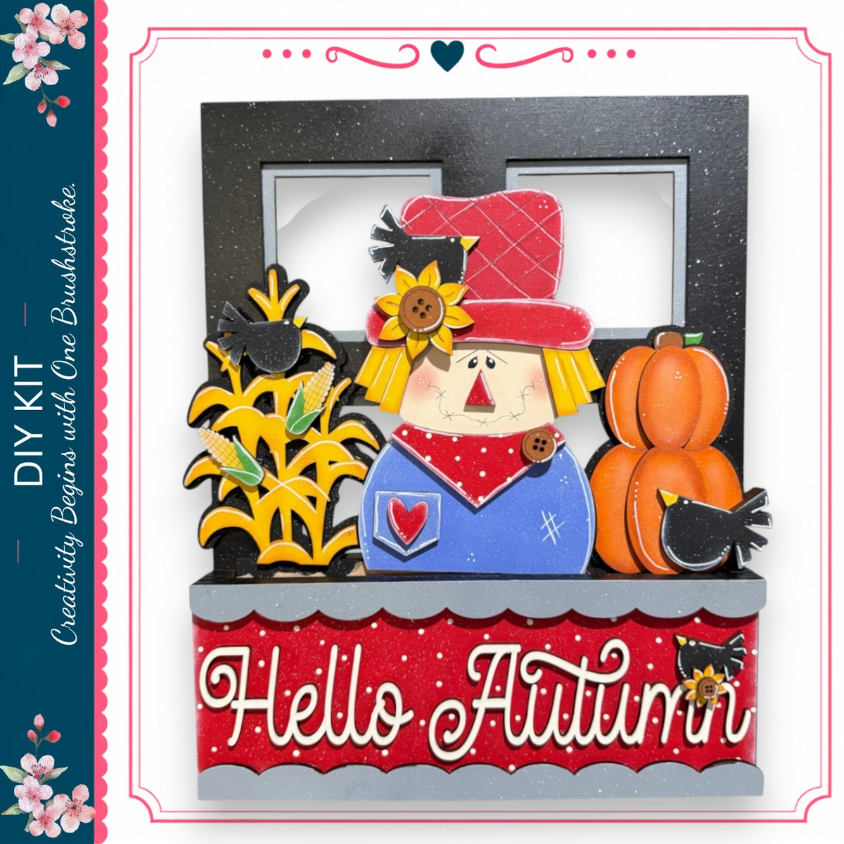 A decorative frame with a scarecrow figure, a pumpkin, and other fall-themed elements, along with the text "Hello Autumn".