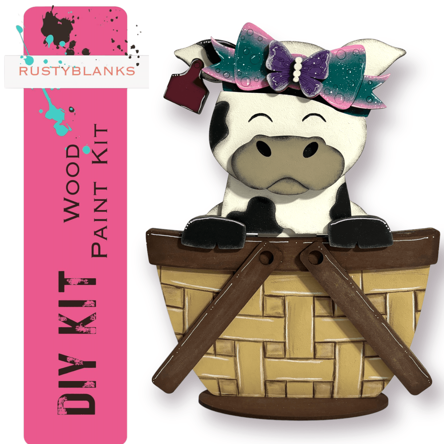 a cow sitting in a basket with a bow on its head