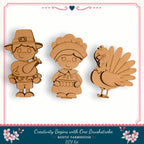 three wooden cutouts of a boy, a girl, and a turkey, arranged in a row.