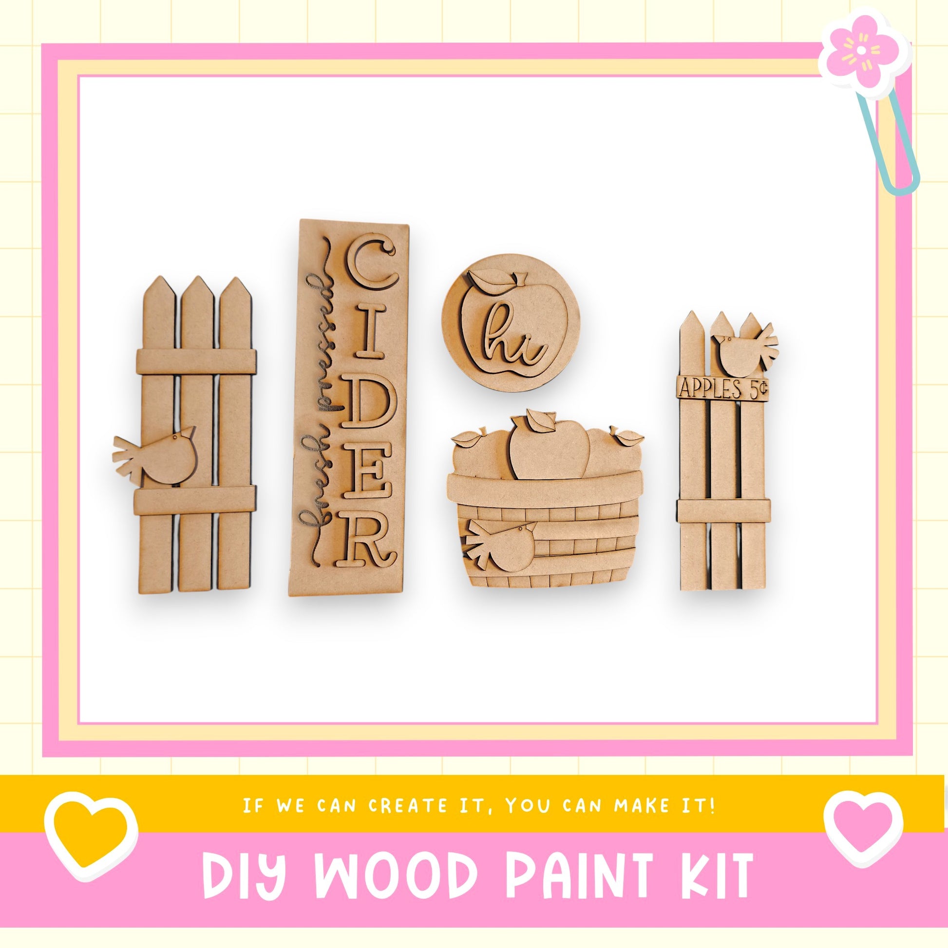 a DIY wood paint kit with various wooden shapes and designs, including a wooden fence, a wooden apple, and a wooden bird.