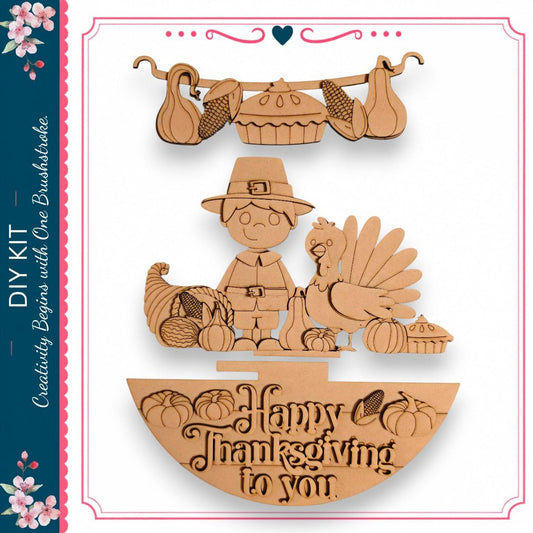 The image is a wooden carving depicting a Thanksgiving scene with a young boy, a turkey, pumpkins, and a pie. The carving includes a carved turkey, a carved pumpkin, and a carved pie. The carving also features a carved pumpkin and a carved turkey. The carving is set against a white background, and the text "Happy Thanksgiving to you" is visible.