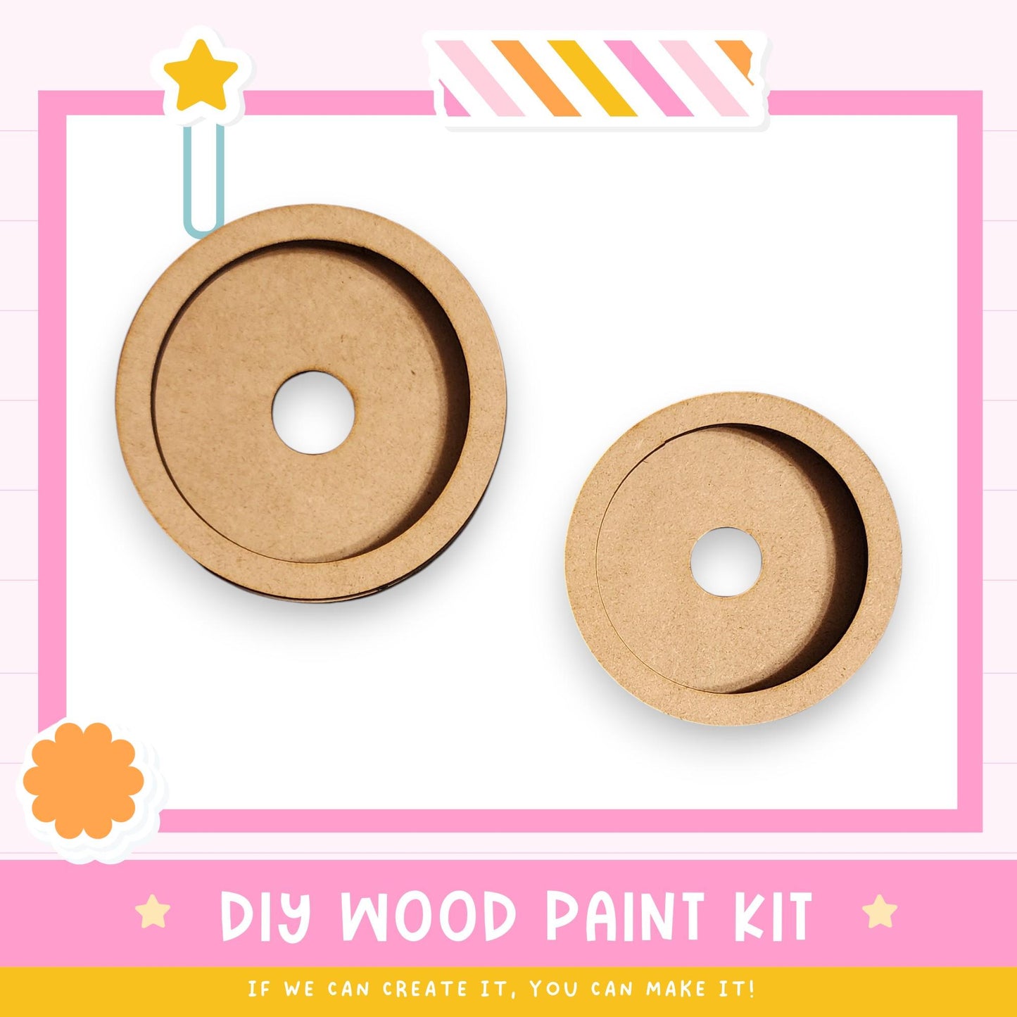 two wooden paint kits, one larger and one smaller, with a pink and white background and a star decoration.
