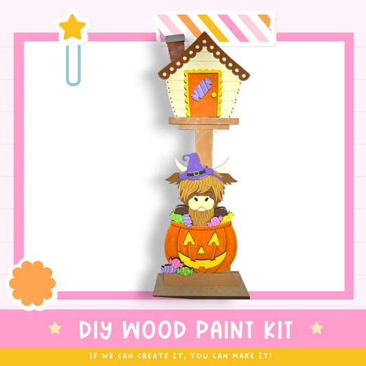 a DIY wood paint kit for creating a Halloween-themed house, with a cartoon character inside a carved pumpkin.