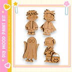 four wooden cutouts of children dressed in Halloween costumes, including a ghost, a mummy, a vampire, and a witch.