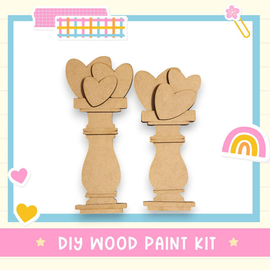 a DIY wood paint kit, with two wooden heart-shaped cutouts arranged in a row against a white background.