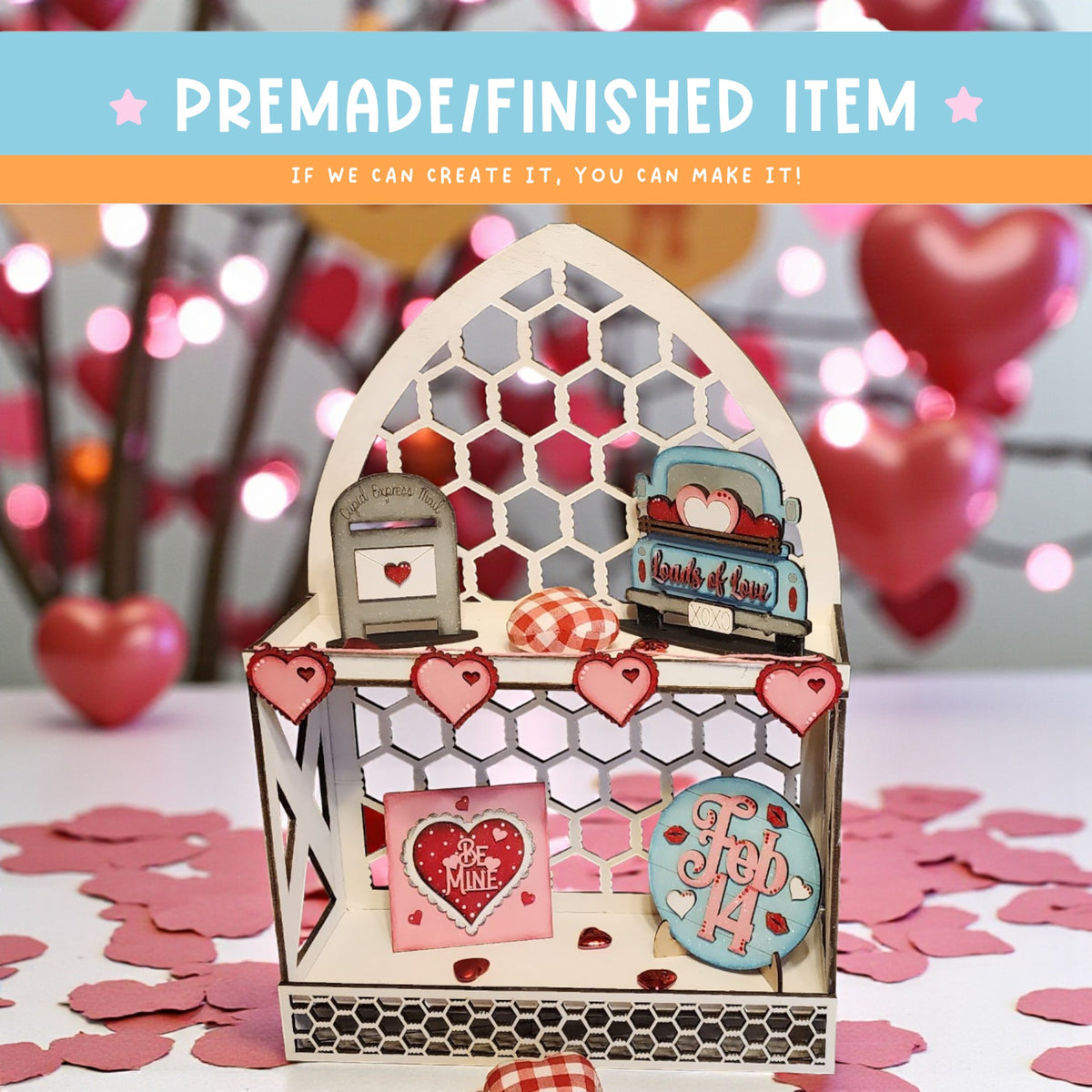 a small, wooden structure with a heart-shaped design, surrounded by heart-shaped confetti on a table.
