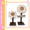 two wooden flower-shaped signs with the word "WELCOME" written on them, placed on a wooden stand.