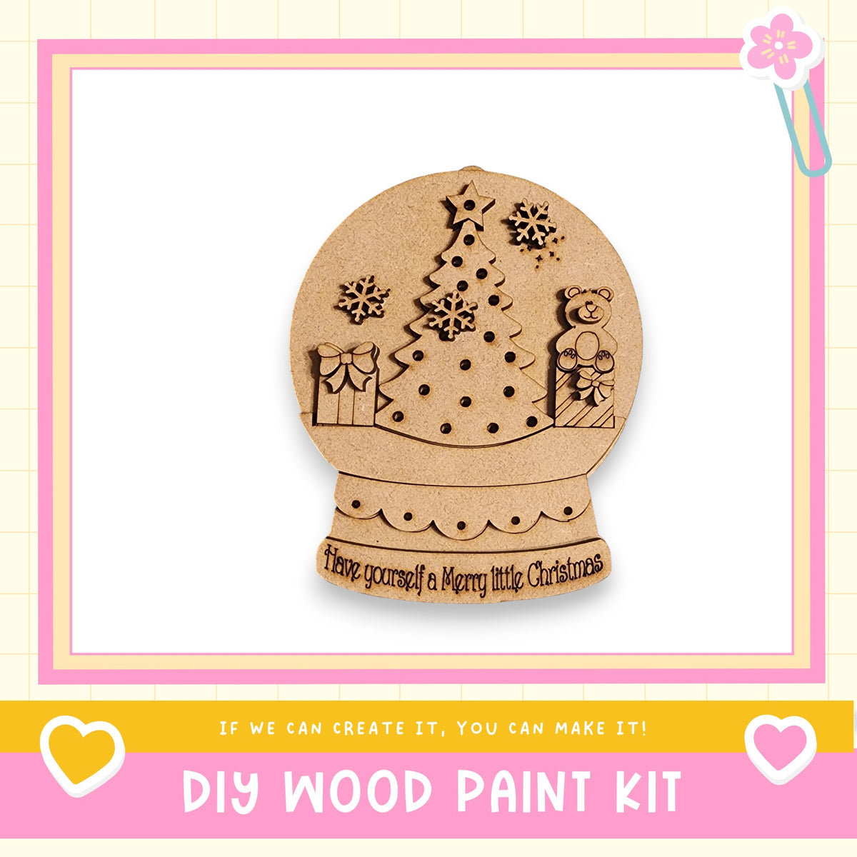 A wooden snow globe with a Christmas tree and a bear, along with the text "Have yourself a Merry little Christmas" and "DIY WOOD PAINT KIT"