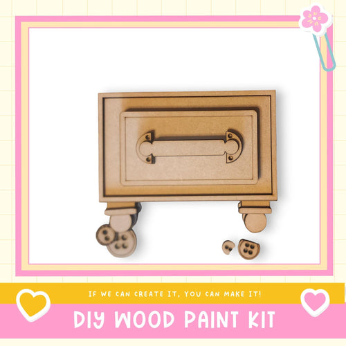 a DIY wood paint kit, with a wooden box and some wooden pieces on a white background.