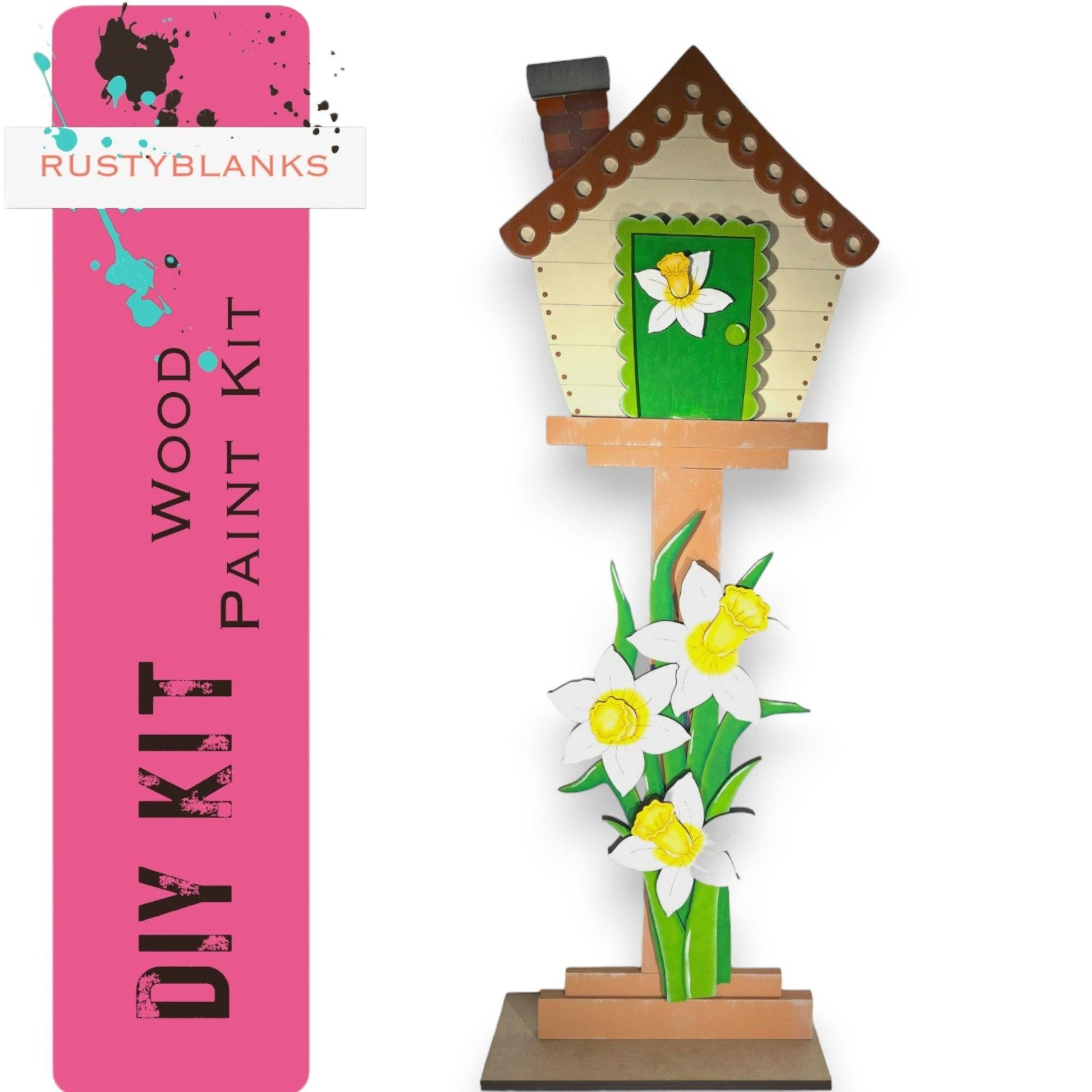 a wooden birdhouse with flowers in a vase