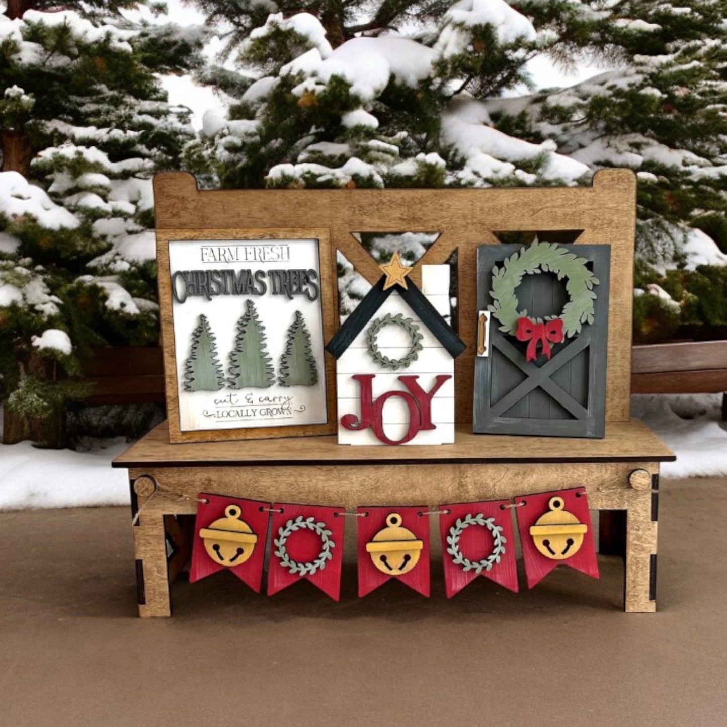 a wooden bench with christmas decorations on it