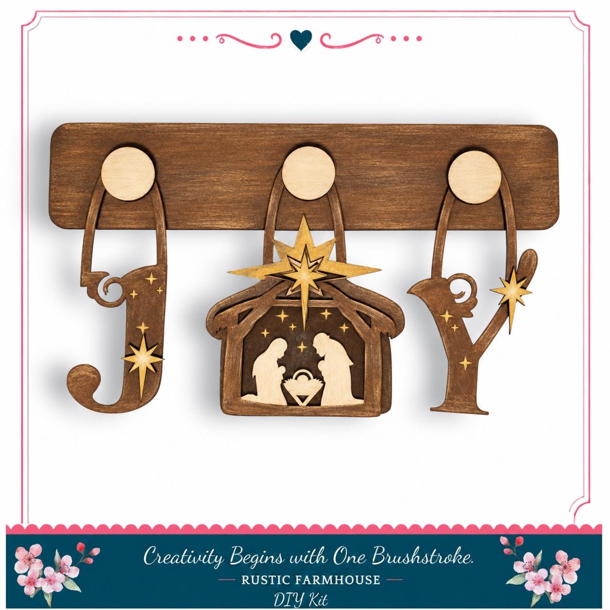 A wooden nativity scene with a man, woman, and baby, along with decorative wooden letters spelling "Joy" and a star above the man.