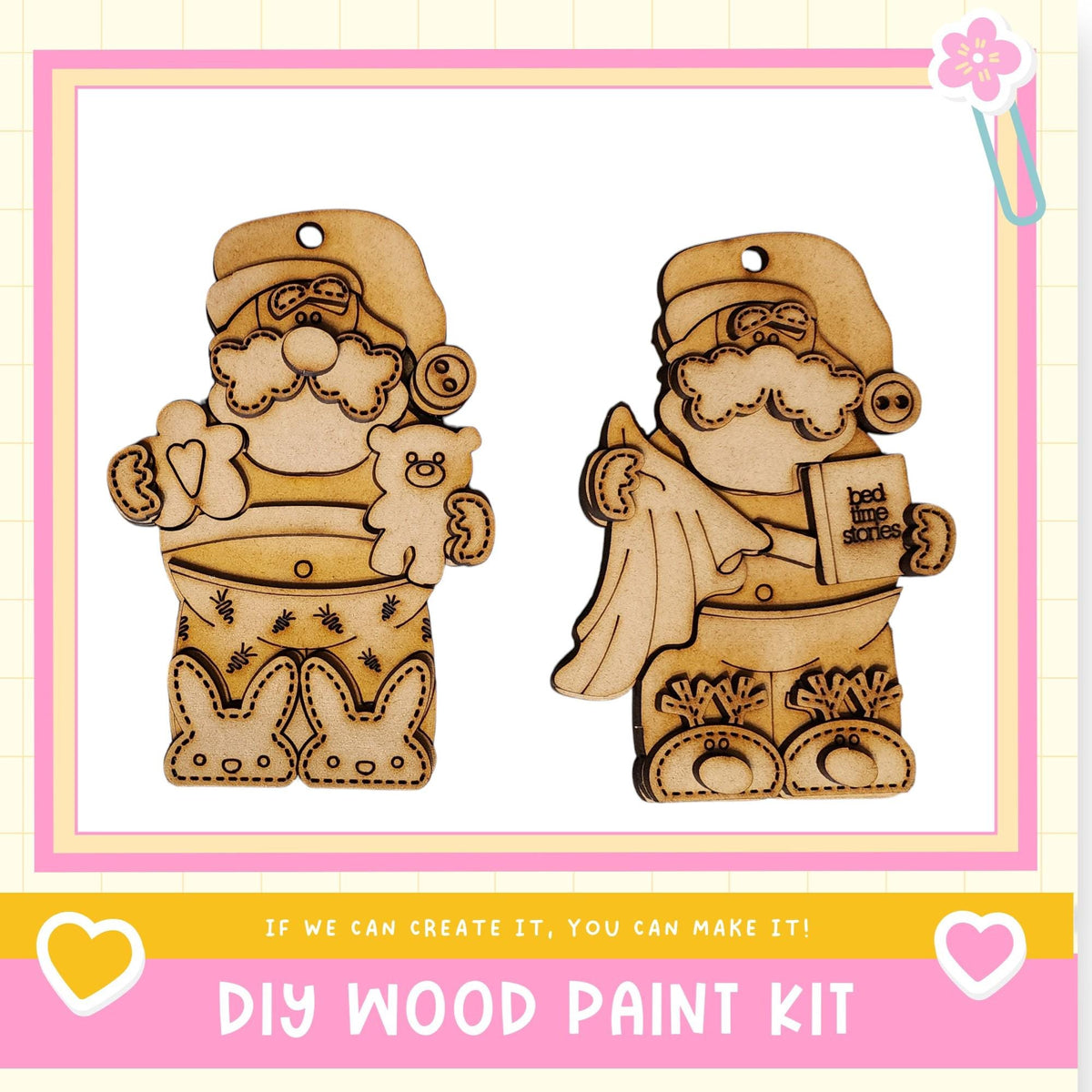 two wooden ornaments, each with a unique design and a small heart-shaped tag attached to them. The text below the image reads "DIY WOOD PAINT KIT" and "IF WE CAN CREATE IT, YOU CAN MAKE IT!"