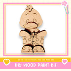 a wooden cutout of a teddy bear with polka dots