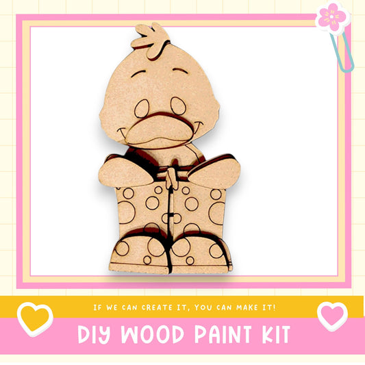 a wooden cutout of a teddy bear with polka dots
