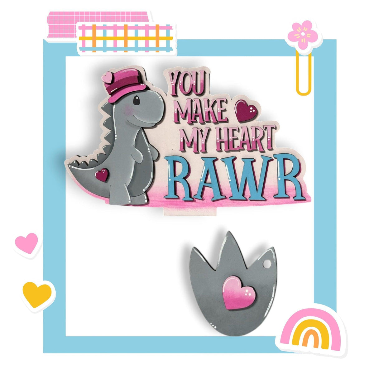 a pair of brooches that say you make my heart rawr