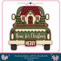 A wooden truck with a house and wreath on the back, displaying the text "Home for Christmas" and "MERRY" on the truck bed.