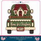 A wooden truck with a house and wreath on the back, displaying the text "Home for Christmas" and "MERRY" on the truck bed.