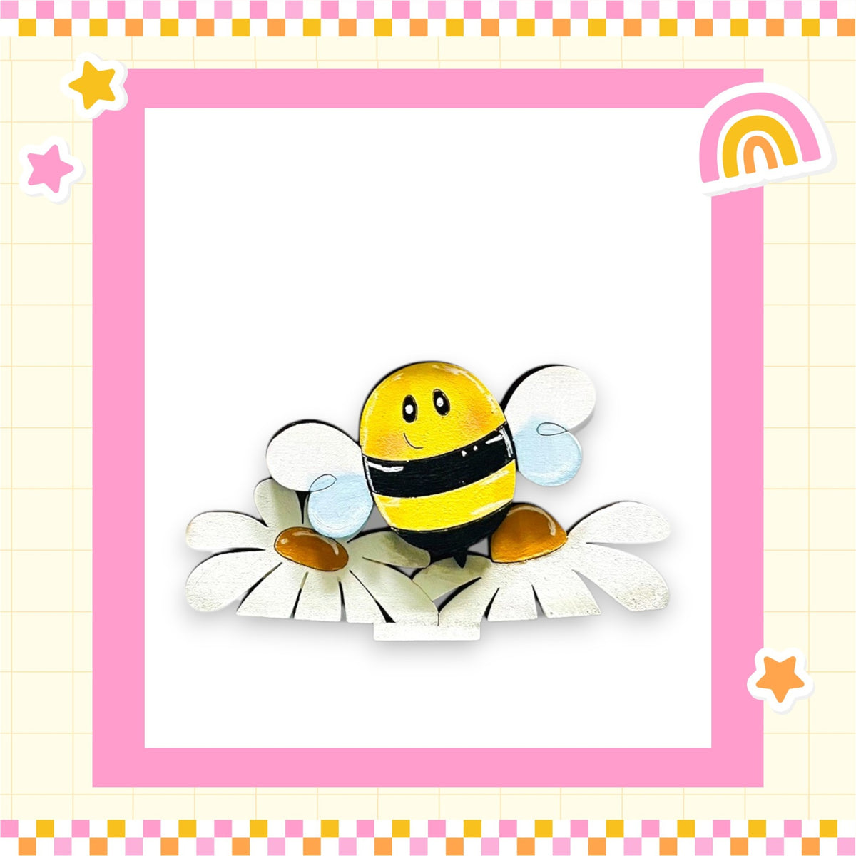 A cheerful cartoon bee is depicted in a pink and yellow frame, surrounded by flowers and stars, creating a whimsical and playful scene.