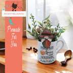 a coffee mug with a plant inside of it