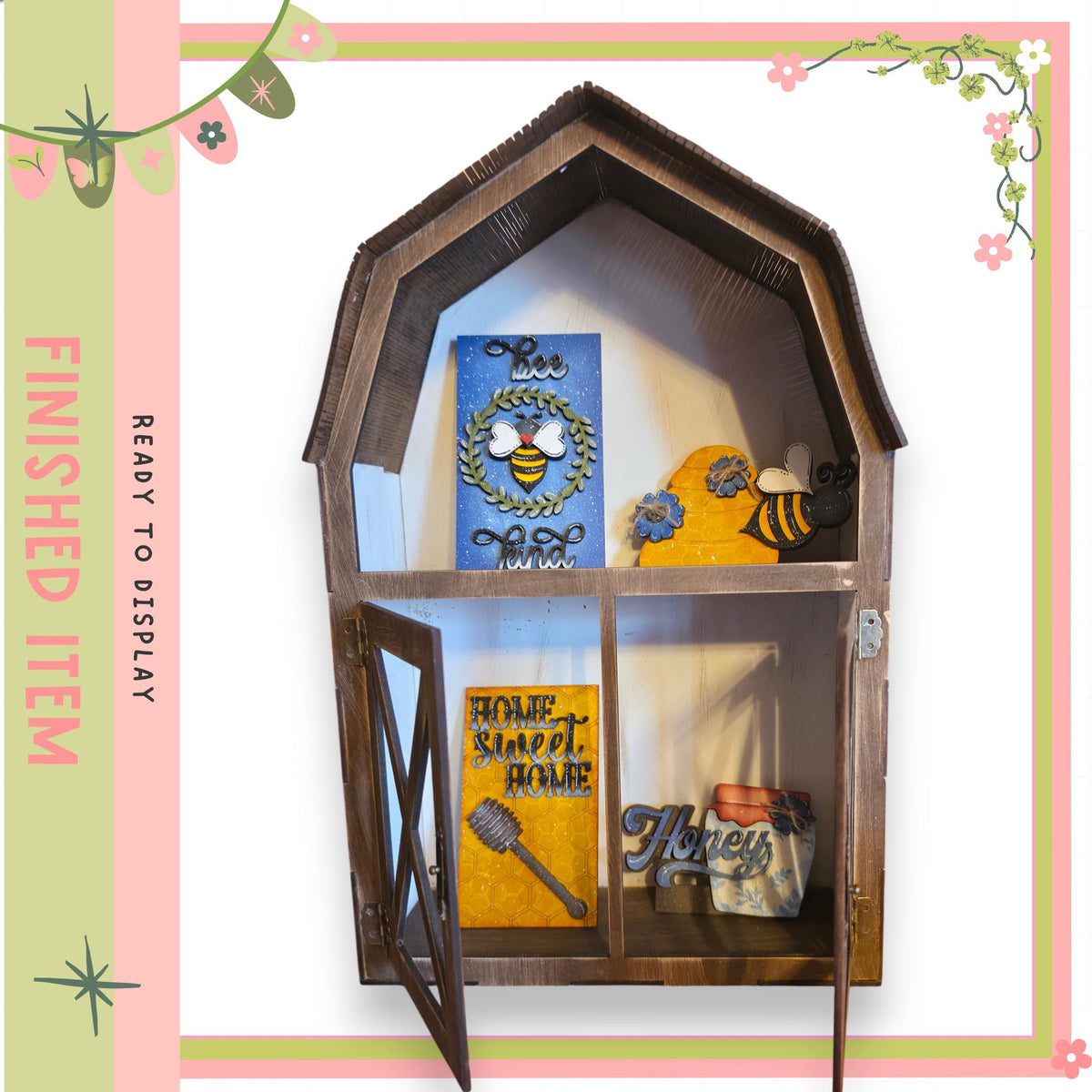 A wooden shelf with a decorative design, displaying various items such as a blue and white sign, a yellow and blue sign, and a small wooden bee figurine.