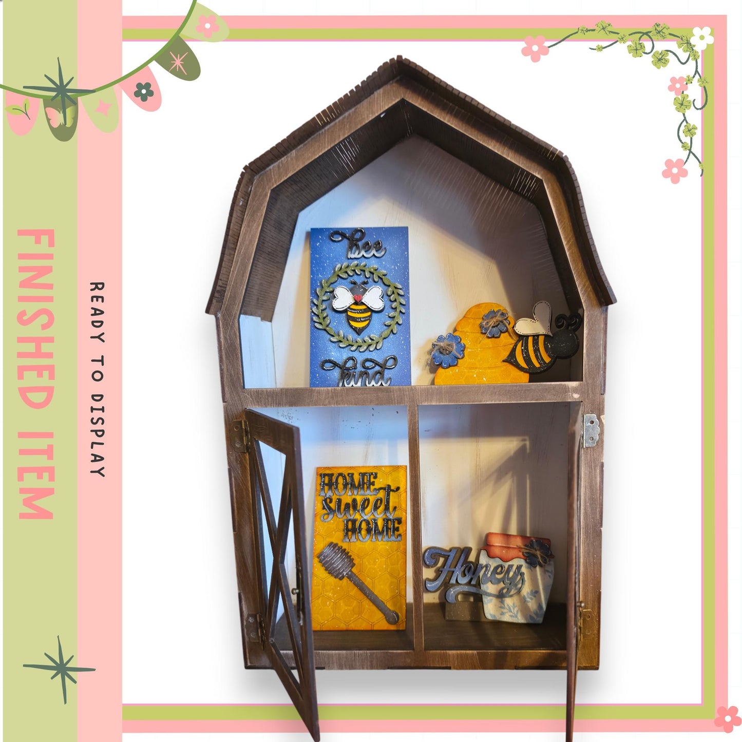 A wooden shelf with a decorative design, displaying various items such as a blue and white sign, a yellow and blue sign, and a small wooden bee figurine.