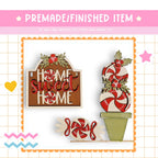 The image is a collage featuring a wooden sign with the phrase "Home Sweet Home", a candy cane decoration, and a potted plant with a candy cane decoration.