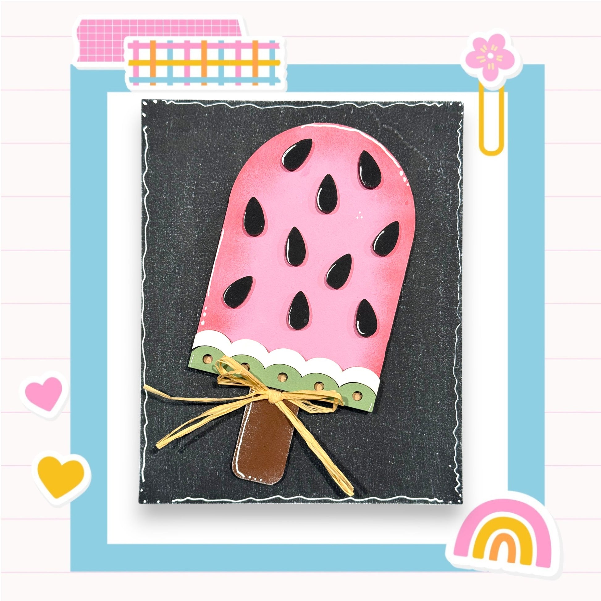 A pink popsicle with black spots is displayed against a black background, surrounded by various colorful and whimsical elements such as hearts, a rainbow, and a flower.