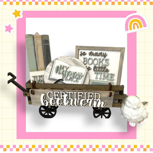 a picture of a cart with books and a teddy bear