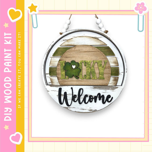 A circular sign with the word "Lucky" and the word "Welcome" written on it, hanging on a wall.