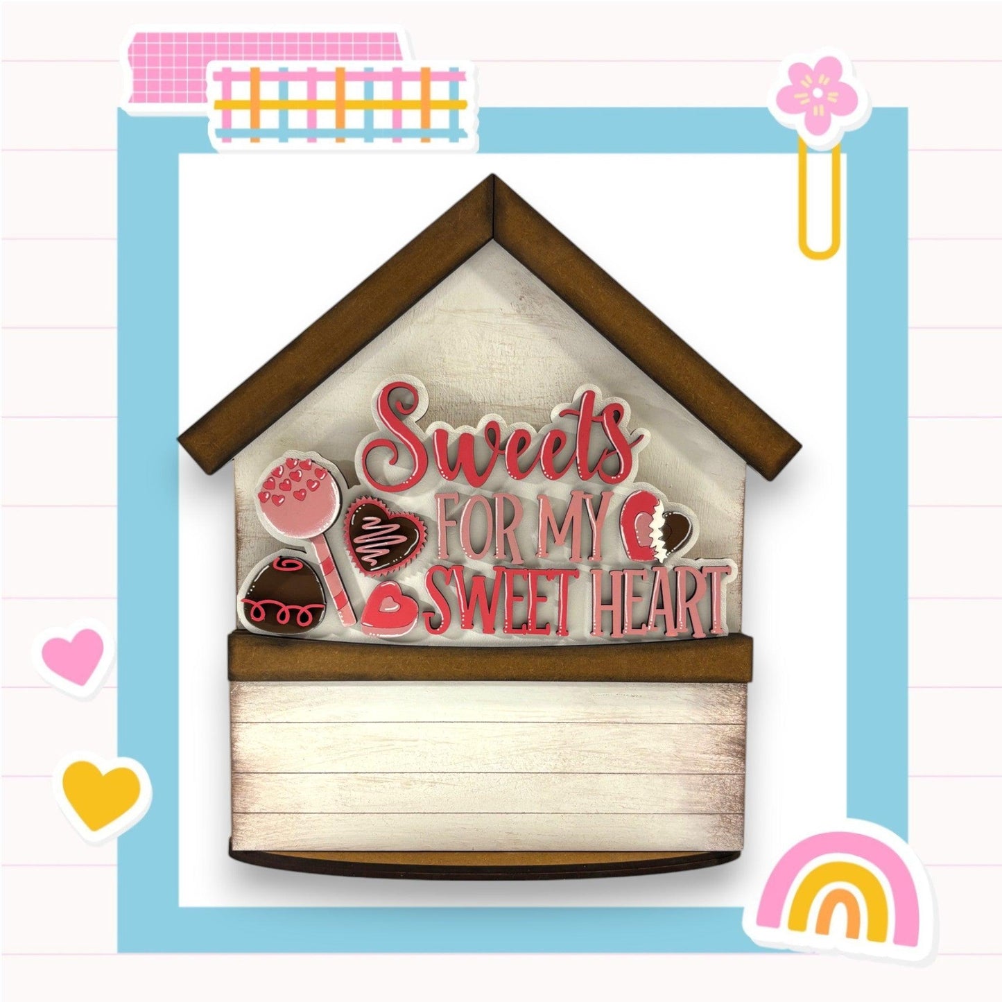 a picture of a bird house with sweet treats on it