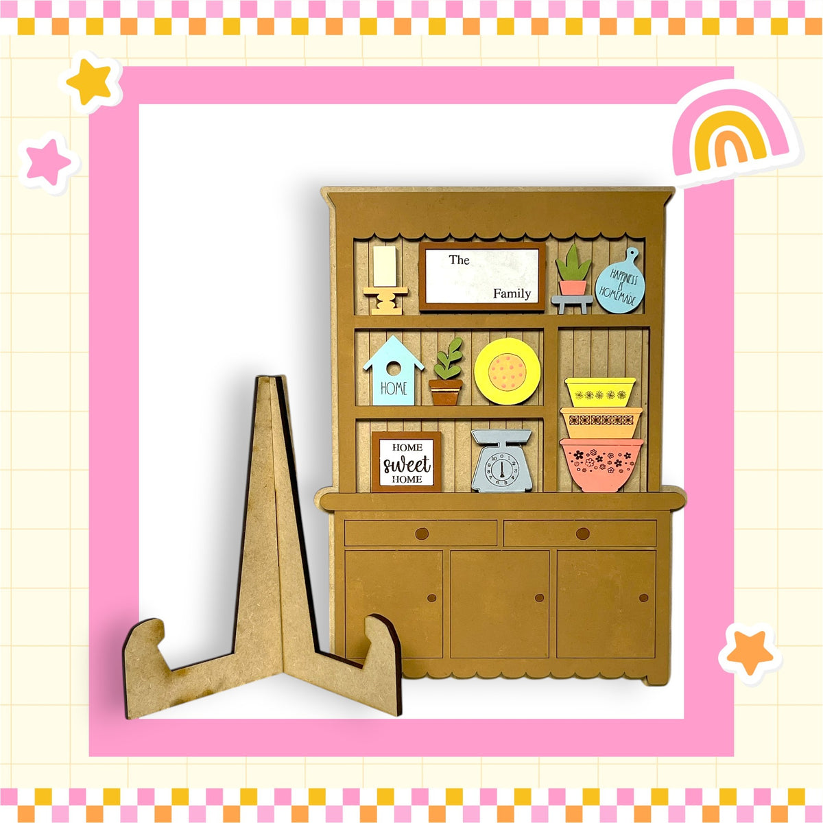 A wooden hutch with various knick-knacks and decorations, including a sign that says "The Family" and a rainbow-colored frame.