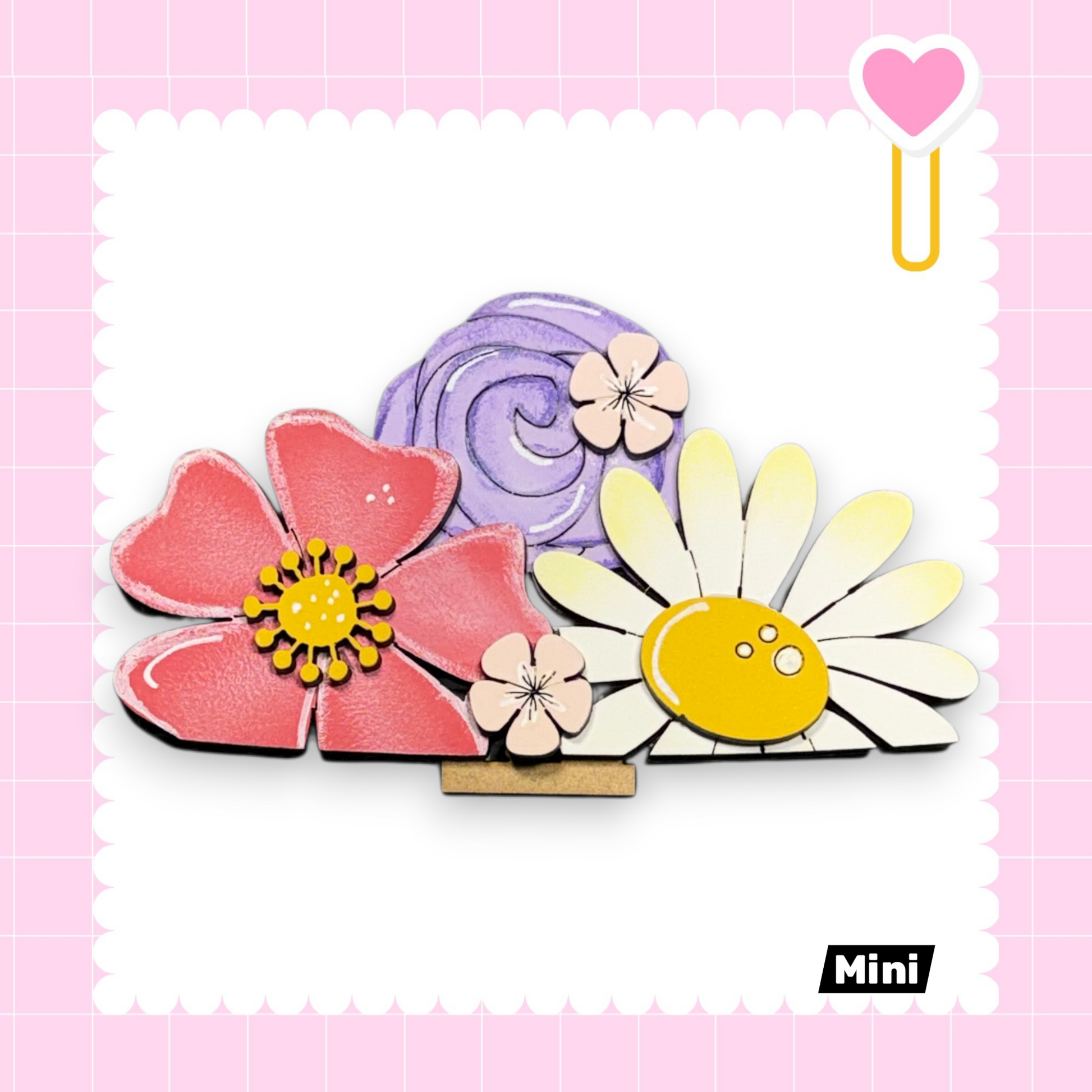 A collage of colorful flowers, including a pink flower, a purple flower, and a yellow flower, arranged in a visually appealing manner.