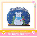 A wooden bear figure with a scarf and snowflakes, set against a starry night sky background, with the text "Warm Winter Wishes" above it.