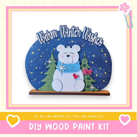 A wooden bear figure with a scarf and snowflakes, set against a starry night sky background, with the text "Warm Winter Wishes" above it.